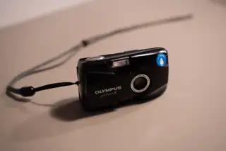 A photograph of the Olympus Mju II camera from the front.